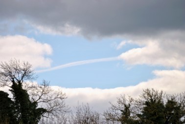 Vapour trail stripe through the hole in the sky!