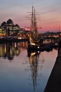 Dublin sunset along Custom House Quay, the replica of the Jeanie Johnson famine ship against the sunset backdrop...