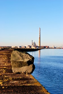 Rocks on the Great South Wall, Dublin Ireland. Storm debris with a difference! Looking towards the city and the Poolbeg Chimneys...