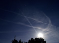 The September 2015 full moon after the eclipse... the planes leave their vapour trails for effect.