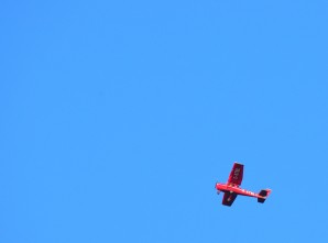 Red plane... blue sky... if you should ever wonder why?