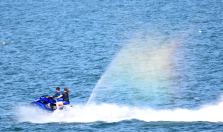 Riding the rainbow - capturing the moment - jet ski having fun along South Beach, Arklow, Co Wicklow, May bank holiday 2018